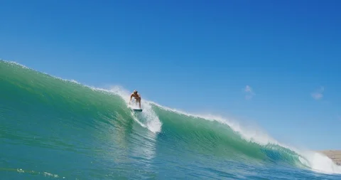 Surfer riding epic ocean wave getting barreled Stock Footage 108219728