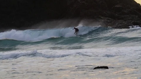 Surfer riding a giant wave Stock Footage 71540462