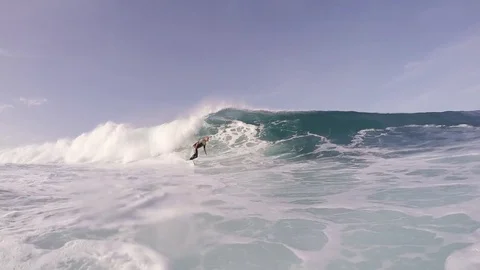 Surfer riding a giant wave Stock Footage 71547104