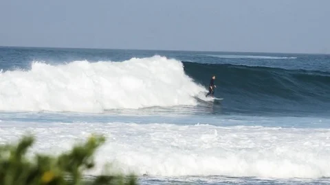 Surfer riding a giant wave Stock Footage 71548112