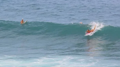 Surfer riding at the ocean big wave Stock Footage 8949570