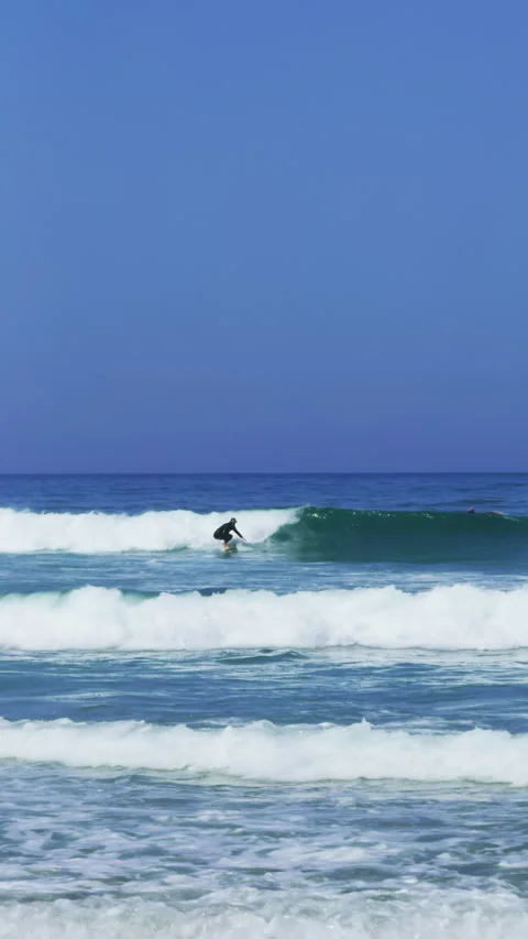 Surfer Riding Ocean Wave with Smooth Long Ride Stock Footage 344947441