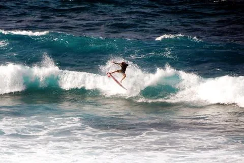 Surfer riding a wave in Hookipa Beach, Maui, Hawaii Stock Photos