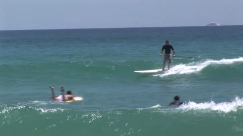 Surfer Riding Wave On Long Paddle Board Stock-Footage 1012350
