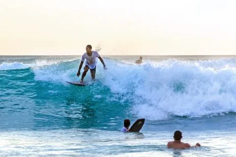 Surfer riding on the wave Stock Photos
