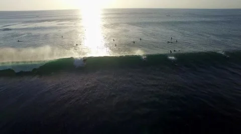 Surfer riding a wave in setting sun (Balangan beach, Bali, Indonesia) Stock Footage 61947483