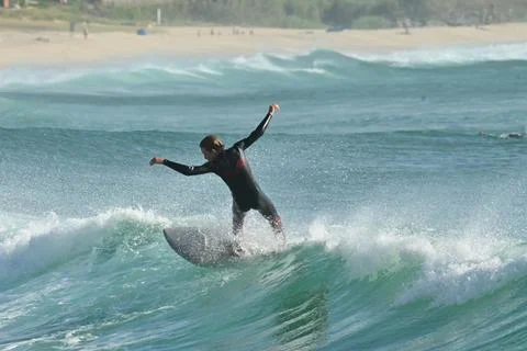 Surfer riding waves along dramatic coastline (9) , 27/08/2025 Stock Photos