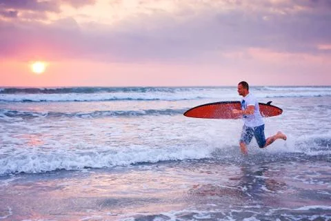 Surfer running Stock Photos