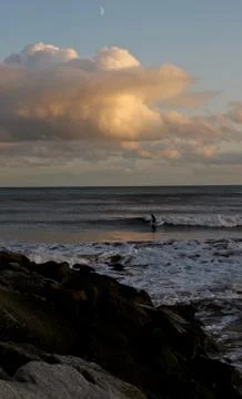 Surfer in the sea at sidmouth in devon Stock Photos