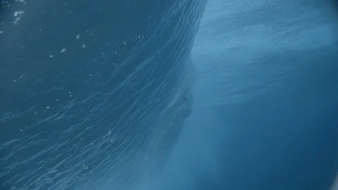 Surfer seen through the rolling sea wave Stock Footage 108644196