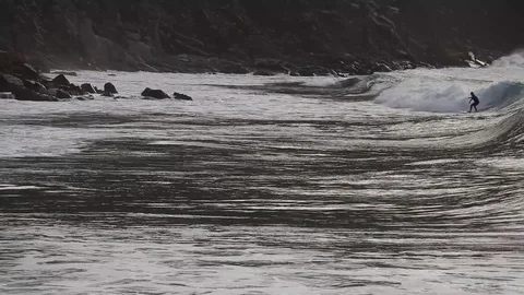 Surfer silhouette on the ocean wave 스톡 동영상 87656665