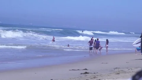 Surfer siting on beach breathing and streaching Stock Footage 71115214