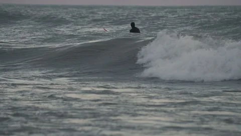 Surfer sits on big waves in Lake Michigan 120fps Video stock 166254313