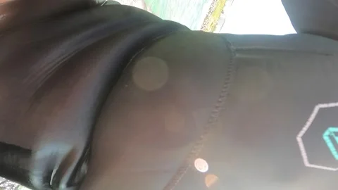 Surfer sitting on surfboard Stock Footage 236253315