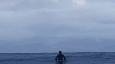 Surfer Sitting on Surfboard in the Ocean 4k 60fps Stock-Footage 135367632