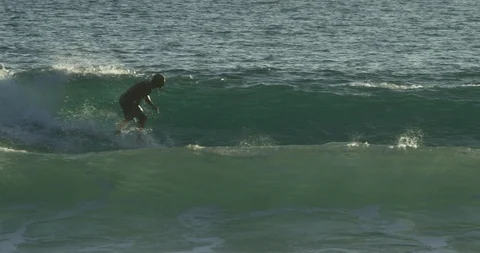 Surfer skillfully surfing in the sea in slow motion Stock Footage 85767065
