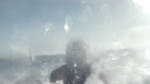 Surfer splashing through waves underwater Stock Footage 169311774