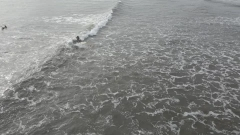 Surfer standing on the board when the waves come Stock Footage 197398399