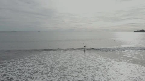 Surfer standing on the board when the waves come. Stock Footage 197398629