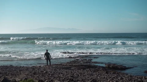 Surfer Standing on Coast Stock Footage 121856999