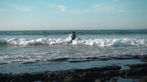Surfer Standing on Coast Stock Footage 121857210
