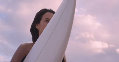 Surfer stares at the ocean Free Stock Footage 102148272