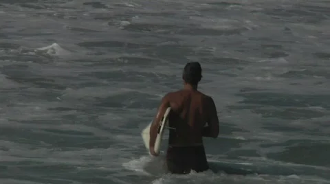 Surfer starting out Stock Footage 590514
