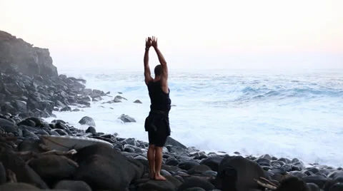 Surfer stretching at jaws Stock Footage 37758540