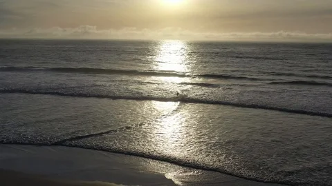 Surfer at Sunset Aerail Stock Footage 124497995