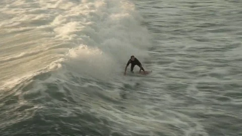 Surfer at sunset Stock Footage 69116810