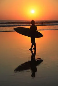 Surfer on sunset Stock Photos
