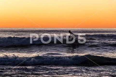 Surfer in the Sunset Stock Photos