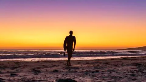 Surfer sunset Stock Photos