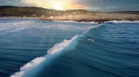 Surfer in the sunset Stock Photos