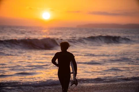 Surfer at sunset Foto stock