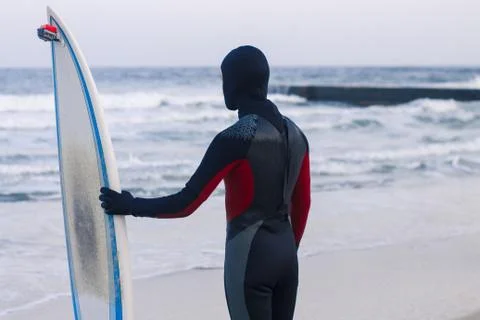 Surfer with surfboard standing Stock Photos