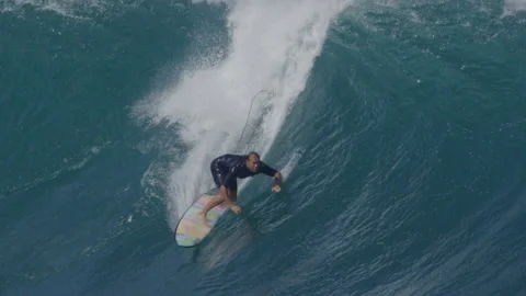 Surfer surfing big barrel tube ocean wave Stock Footage