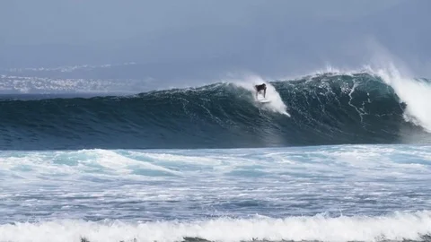 Surfer surfing a big wave Stock Footage 71537841