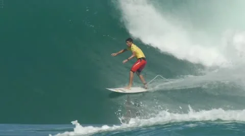 Surfer surfing in big wave north shore Hawaii slow motion Stock Footage