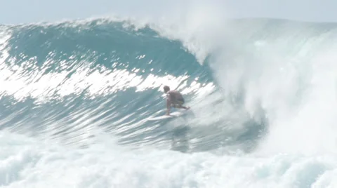 Surfer surfing in big wave north shore Hawaii banzai pipeline Stock Footage