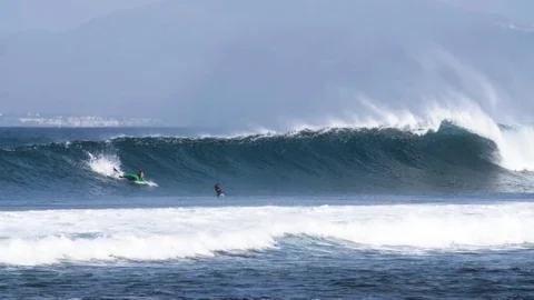 Surfer surfing a giant wave Stock Footage 71537467