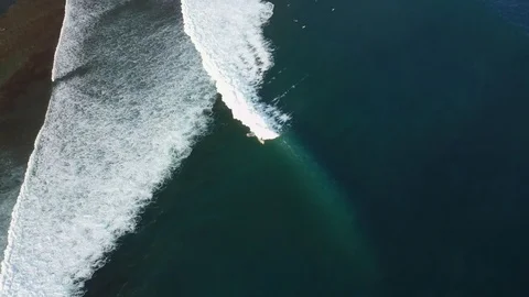 Surfer surfing large wave - Drone shot in Uluwatu, Bali Indonesia Stock Footage 96414866