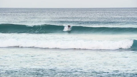 Surfer surfing in the ocean Stock Footage 85825976