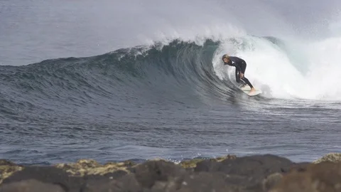 Surfer surfing on ocean waves Video stock 85813831
