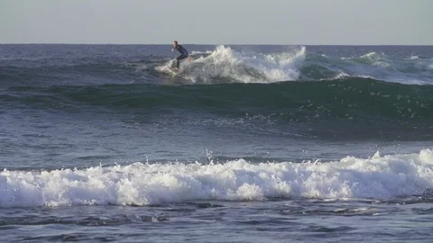 Surfer surfing on ocean waves Stock Footage 85814997