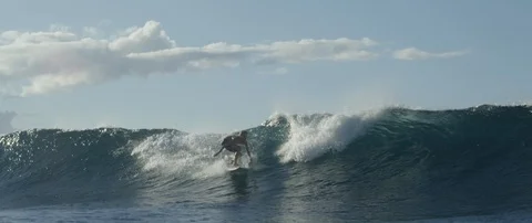 Surfer surfing over the big wave in sea Stock Footage 108642202