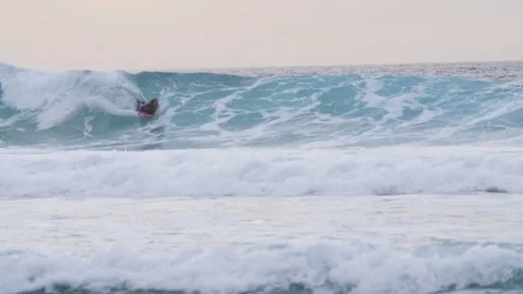 Surfer surfing on turquoise wave Stock Footage 71540125