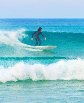 Surfer surfing on a wave Stock Photos
