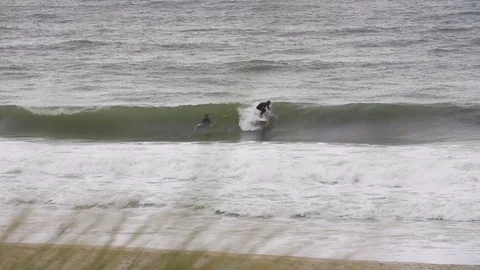 Surfer surfing on waves in slow motion Stock Footage 71566060