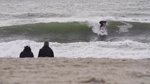 Surfer surfing on waves in slow motion Stock Footage 71566285